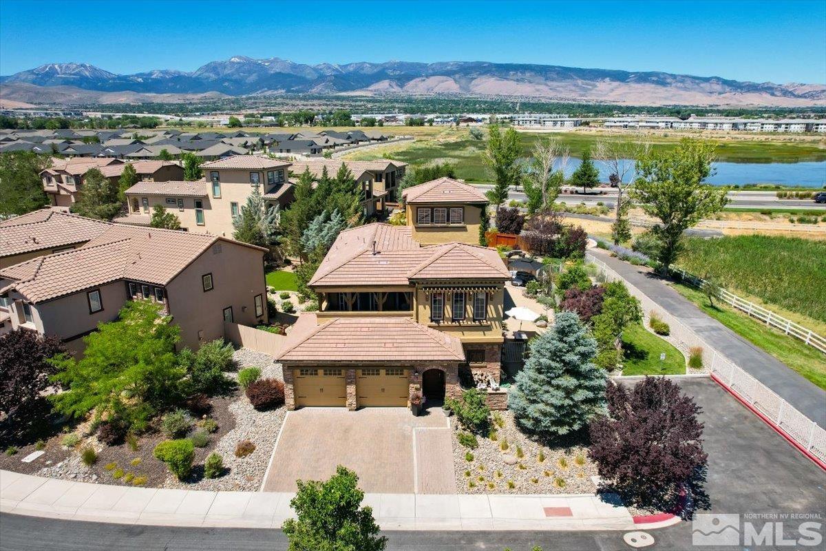 10675 Solano Court Reno, NV 89521 - Photo 1 of 39 an aerial view of residential houses with outdoor space and ocean view