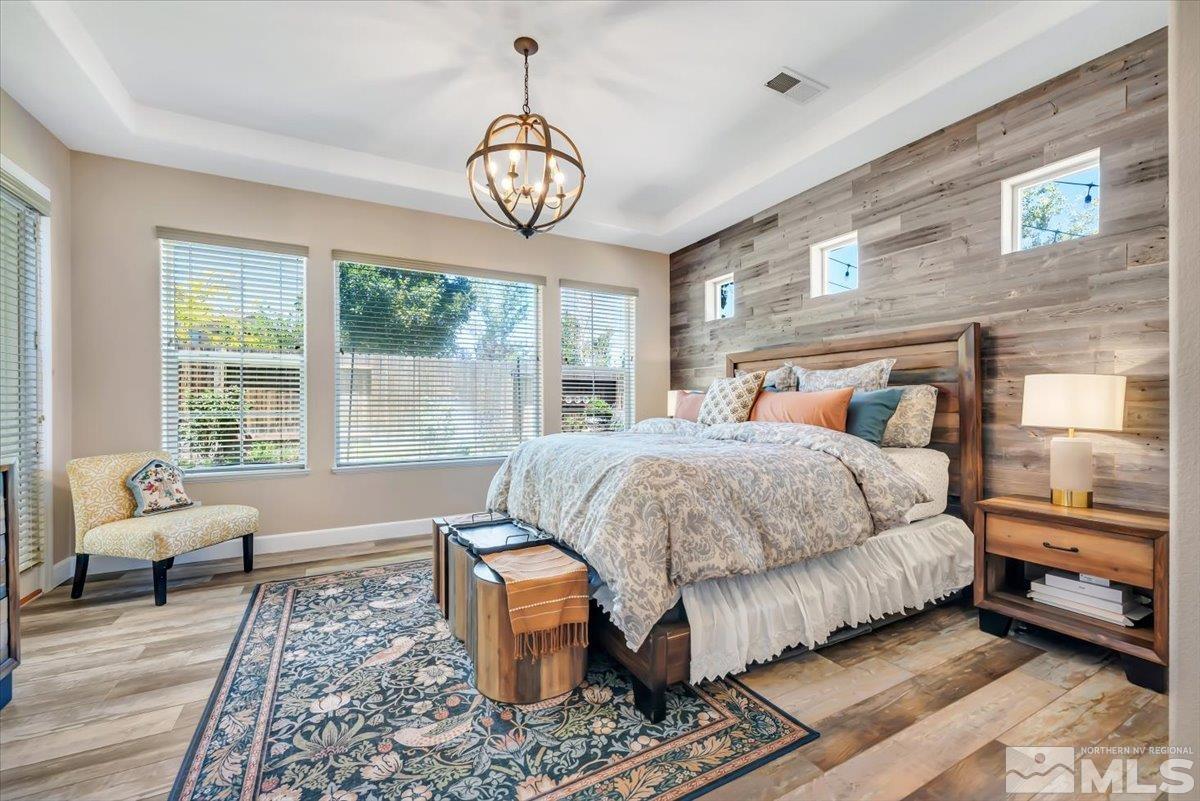 10675 Solano Court Reno, NV 89521 - Photo 15 of 39 a bedroom with a large bed and a window
