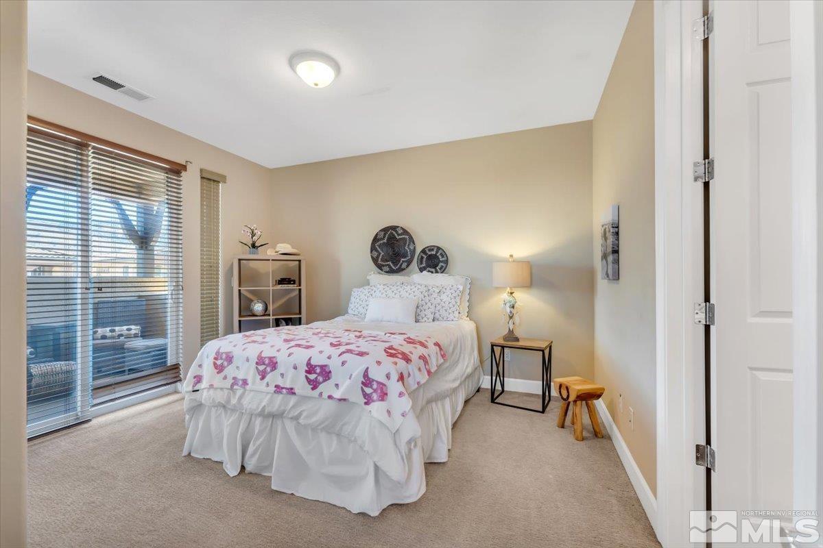 10675 Solano Court Reno, NV 89521 - Photo 19 of 39 a bedroom with a bed and a window