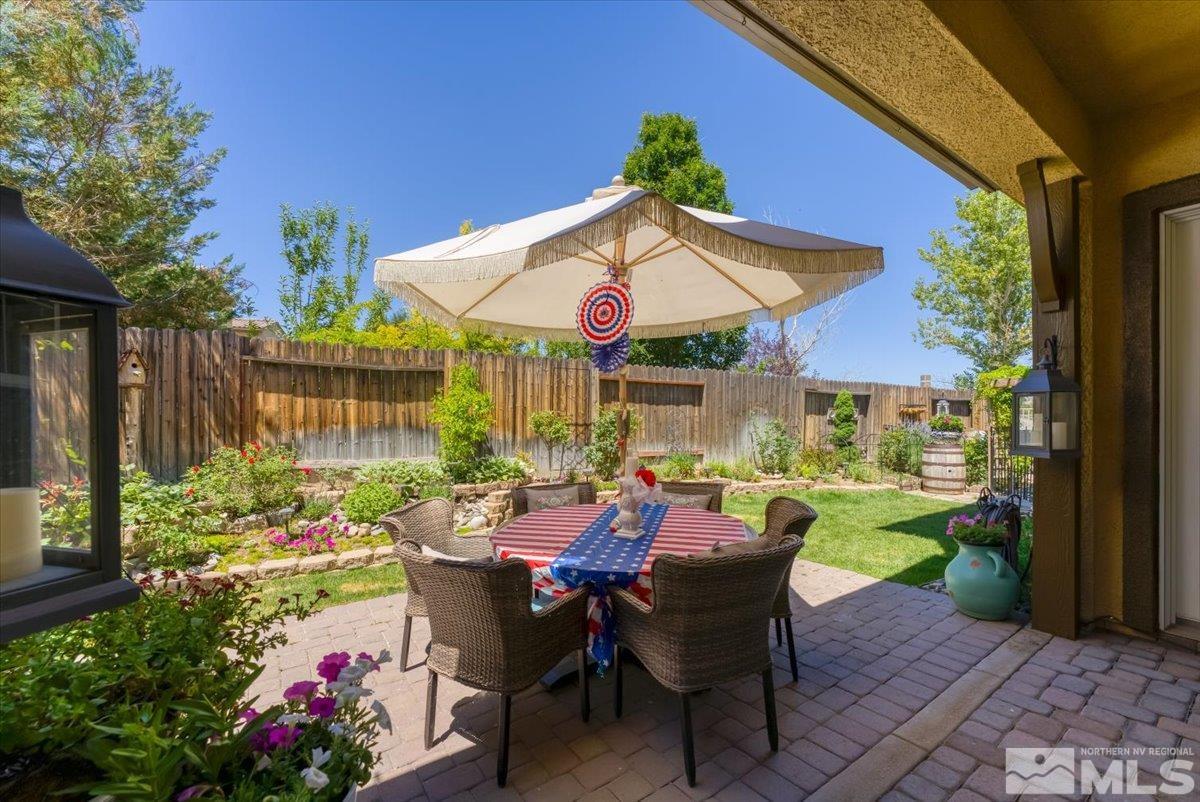 10675 Solano Court Reno, NV 89521 - Photo 36 of 39 a view of a patio with table and chairs potted plants