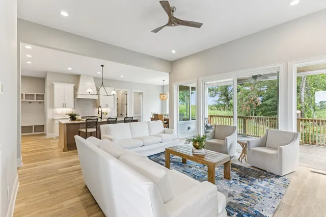 a kitchen with kitchen island a counter top space and stainless steel appliances with cabinets