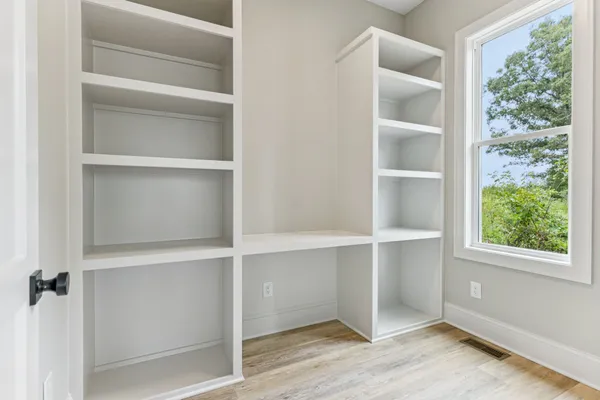 a room with a bed and a window