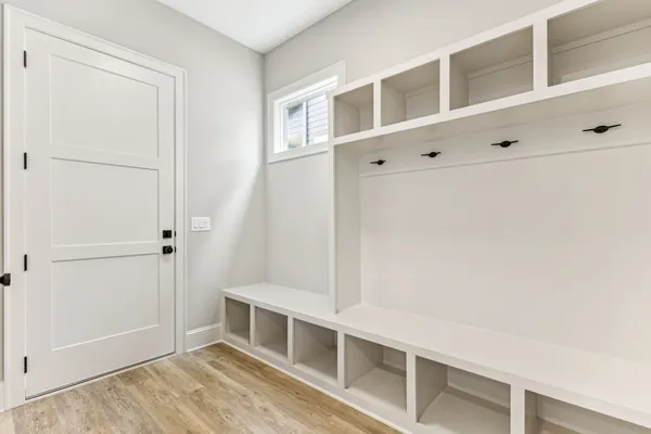 a bathroom with double vanity sinks and a mirror
