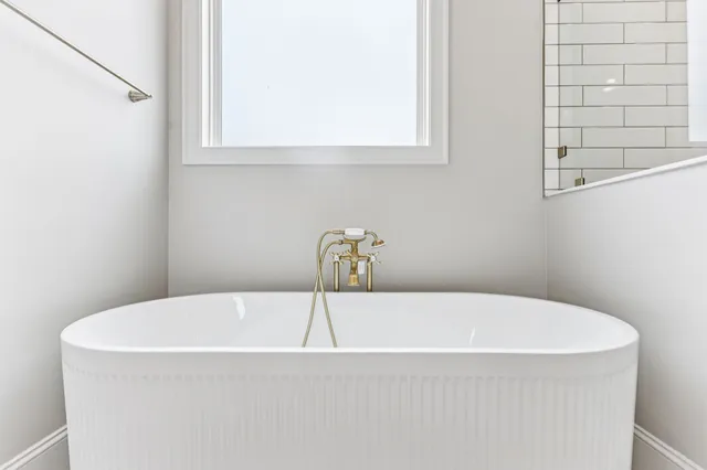 a bed room with a bed and a large window