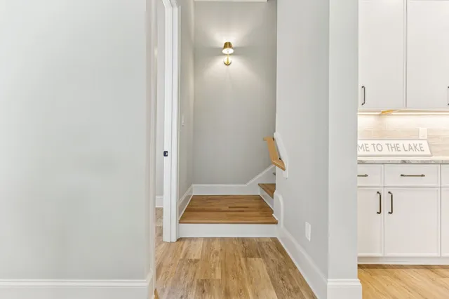 a view of a porch with wooden floor and outdoor space