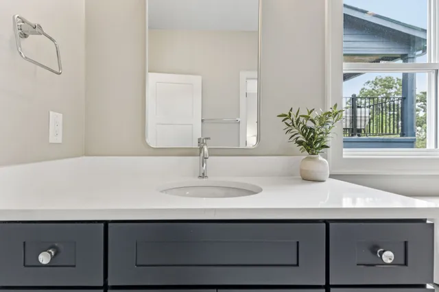 a view of a lake with houses in the back