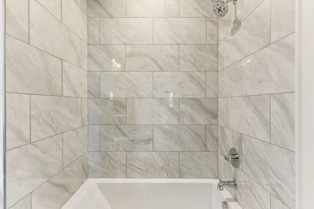 a view of a house with a yard and plant in front of it