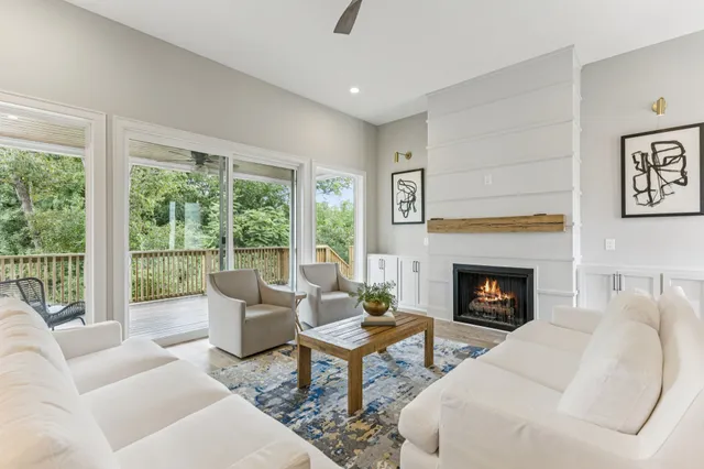 a kitchen with granite countertop a sink cabinets and stainless steel appliances
