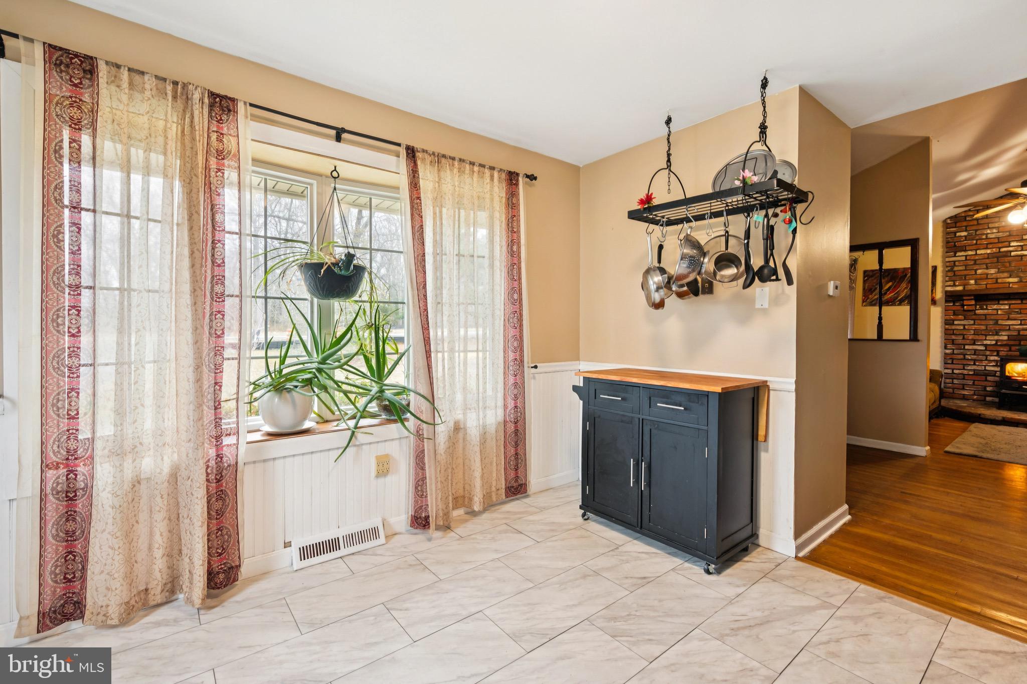 2409 Fries Mill Road Williamstown, NJ 08094 - Photo 12 of 30 a view of a hallway to a livingroom with furniture wooden floor and windows