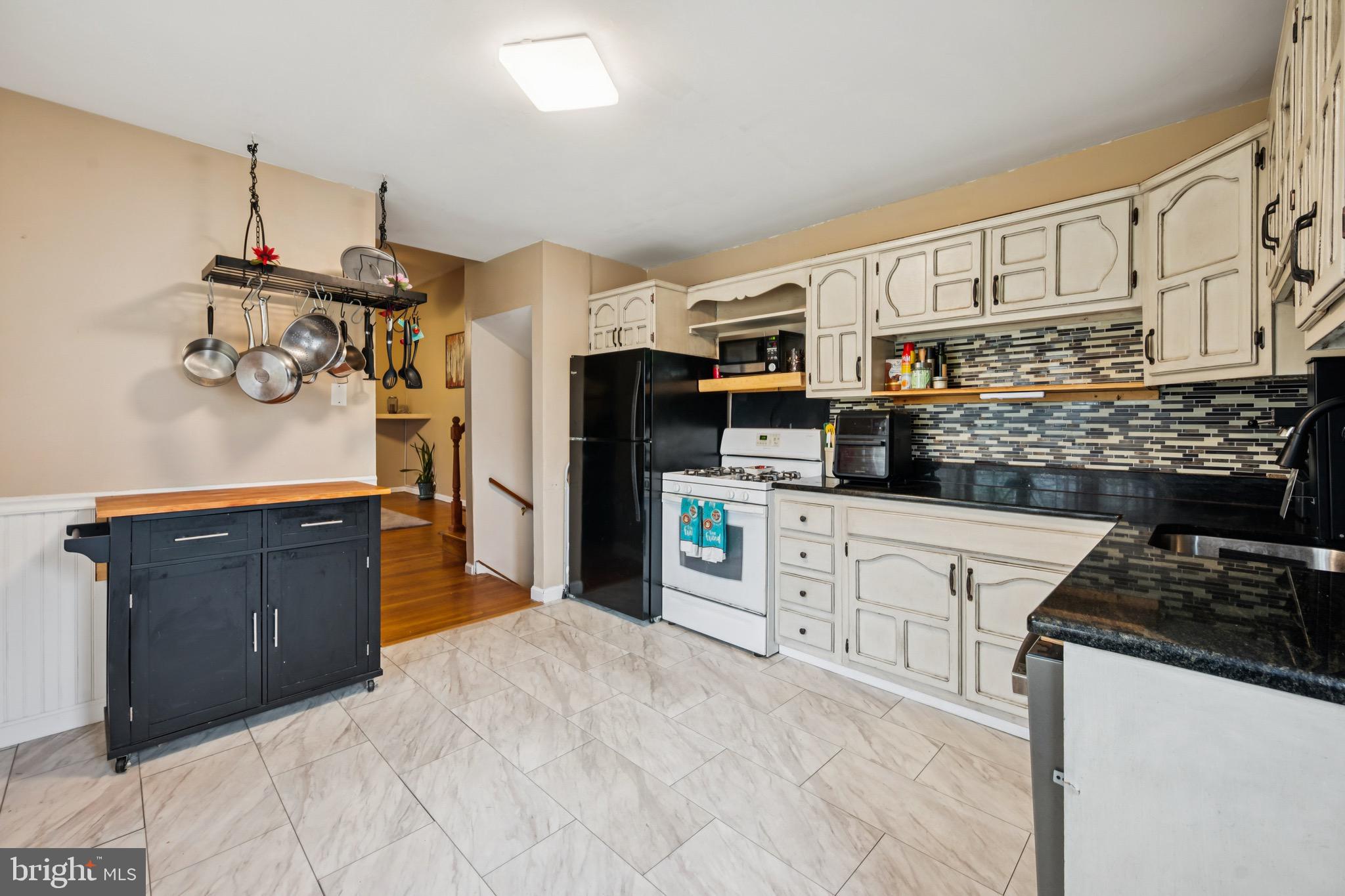 2409 Fries Mill Road Williamstown, NJ 08094 - Photo 13 of 30 a kitchen with stainless steel appliances granite countertop a stove and cabinets