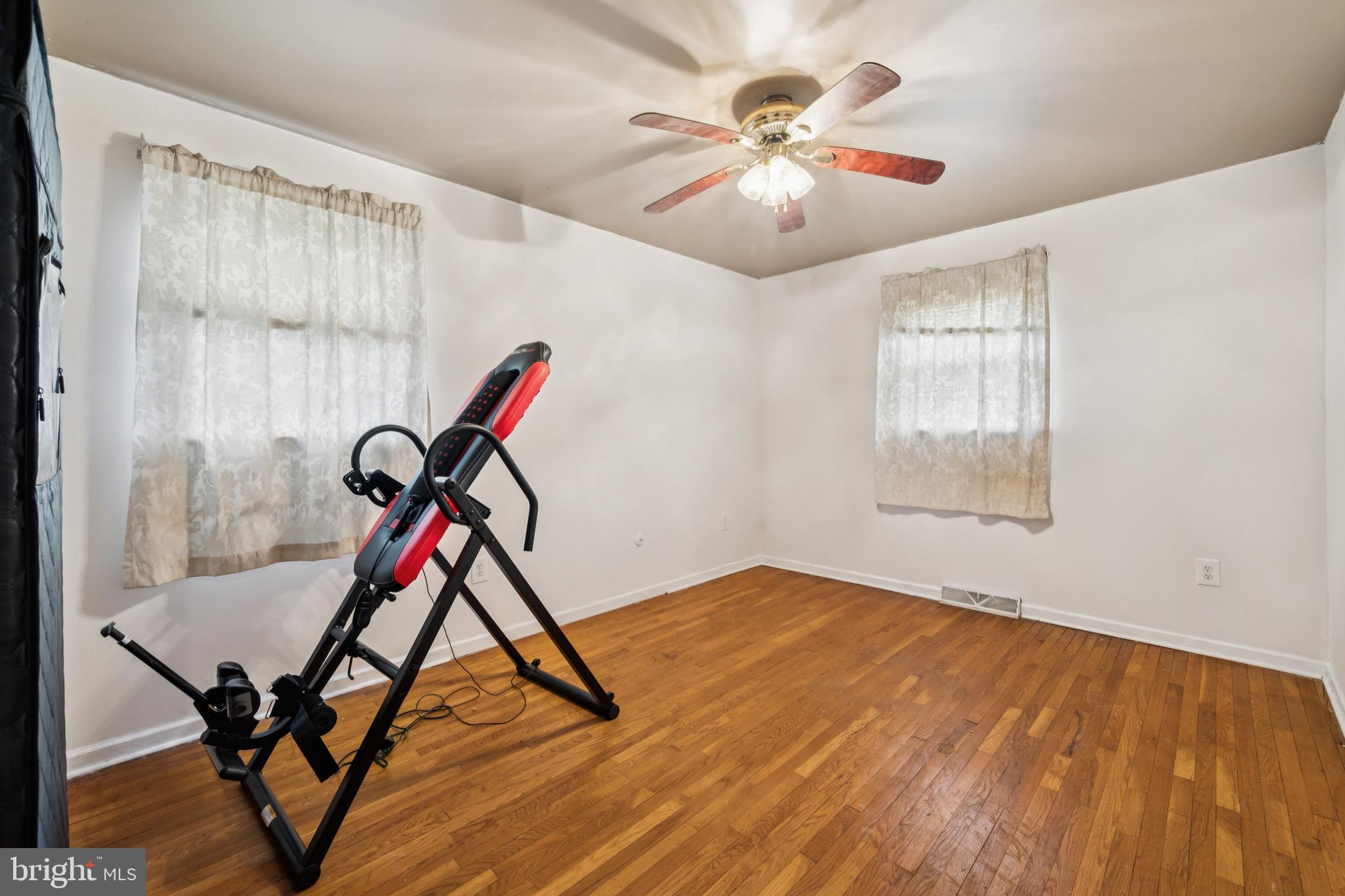 2409 Fries Mill Road Williamstown, NJ 08094 - Photo 16 of 30 a view of a room with windows and wooden floor