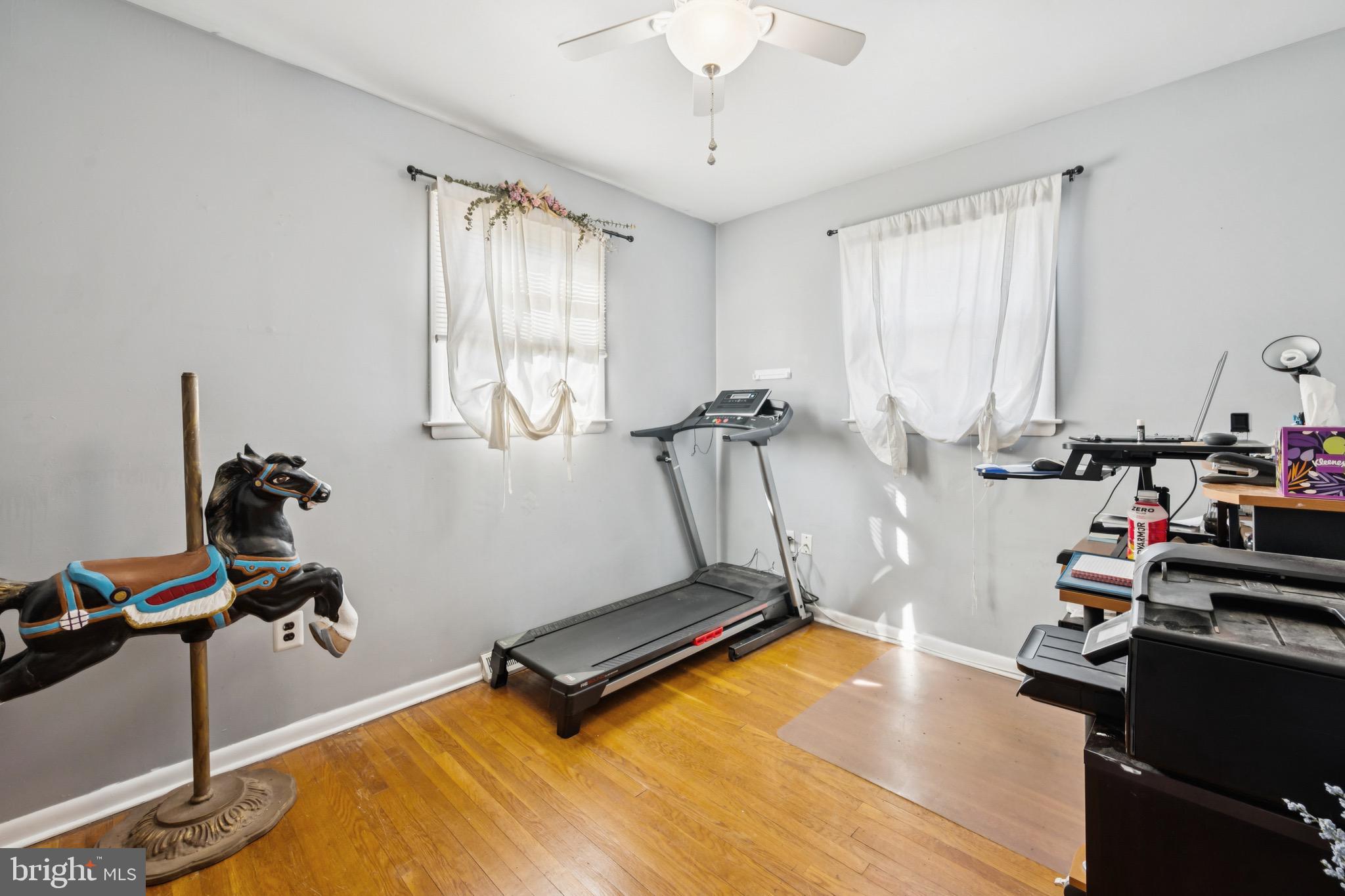 2409 Fries Mill Road Williamstown, NJ 08094 - Photo 18 of 30 a room with gym equipment and windows