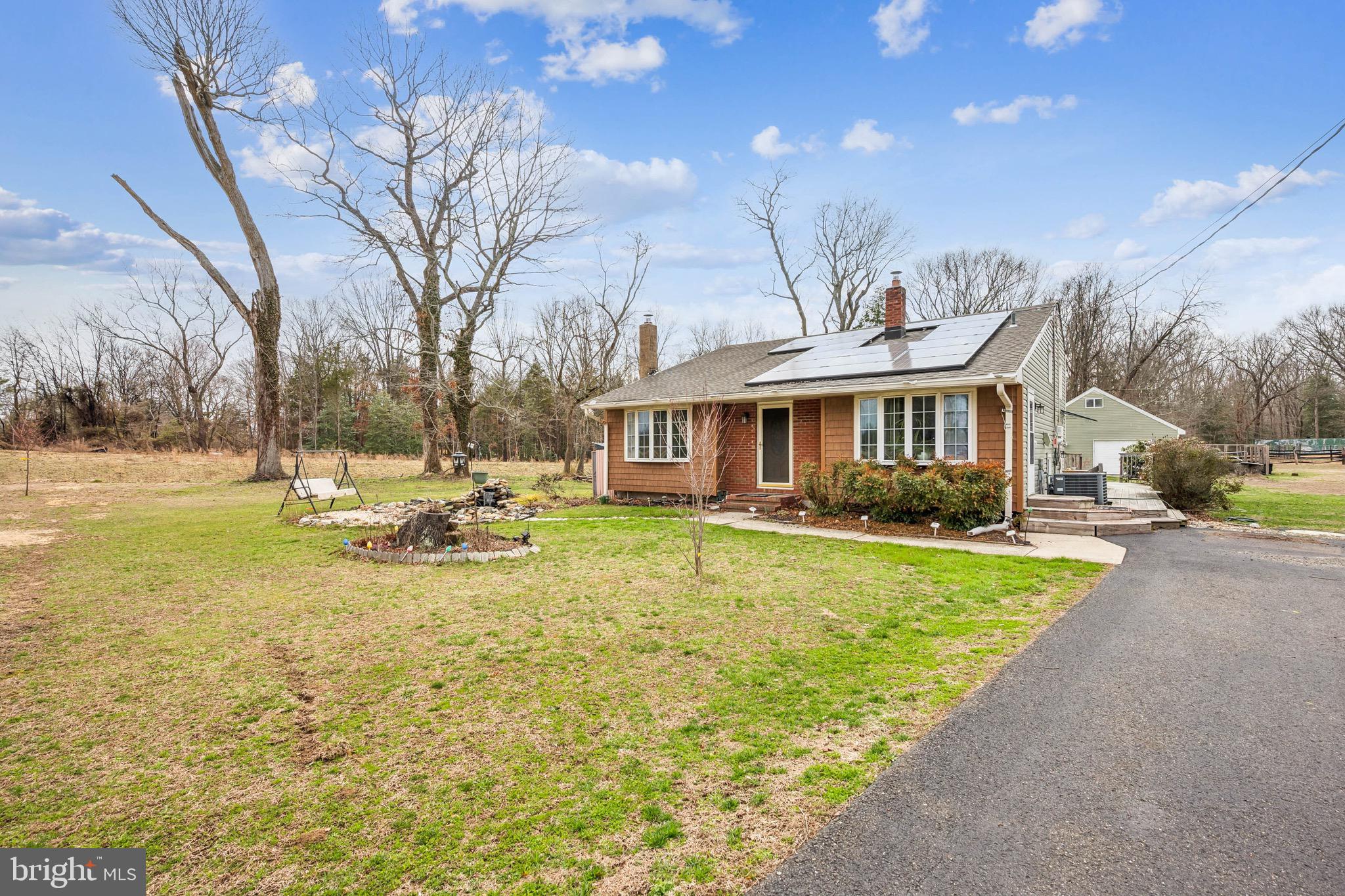 2409 Fries Mill Road Williamstown, NJ 08094 - Photo 2 of 30 a view of a house with swimming pool and sitting area