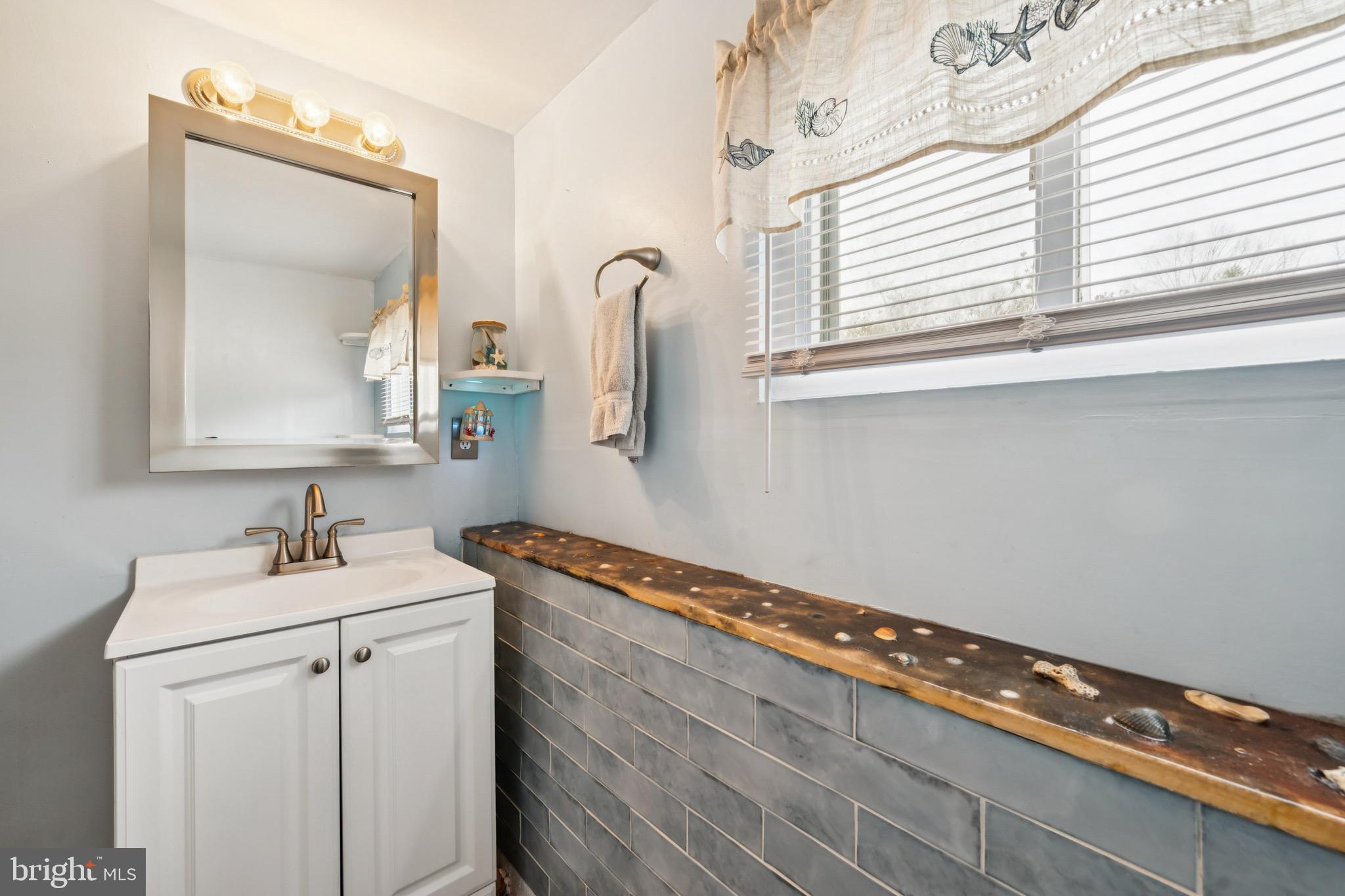 2409 Fries Mill Road Williamstown, NJ 08094 - Photo 21 of 30 a bathroom with a sink and a mirror