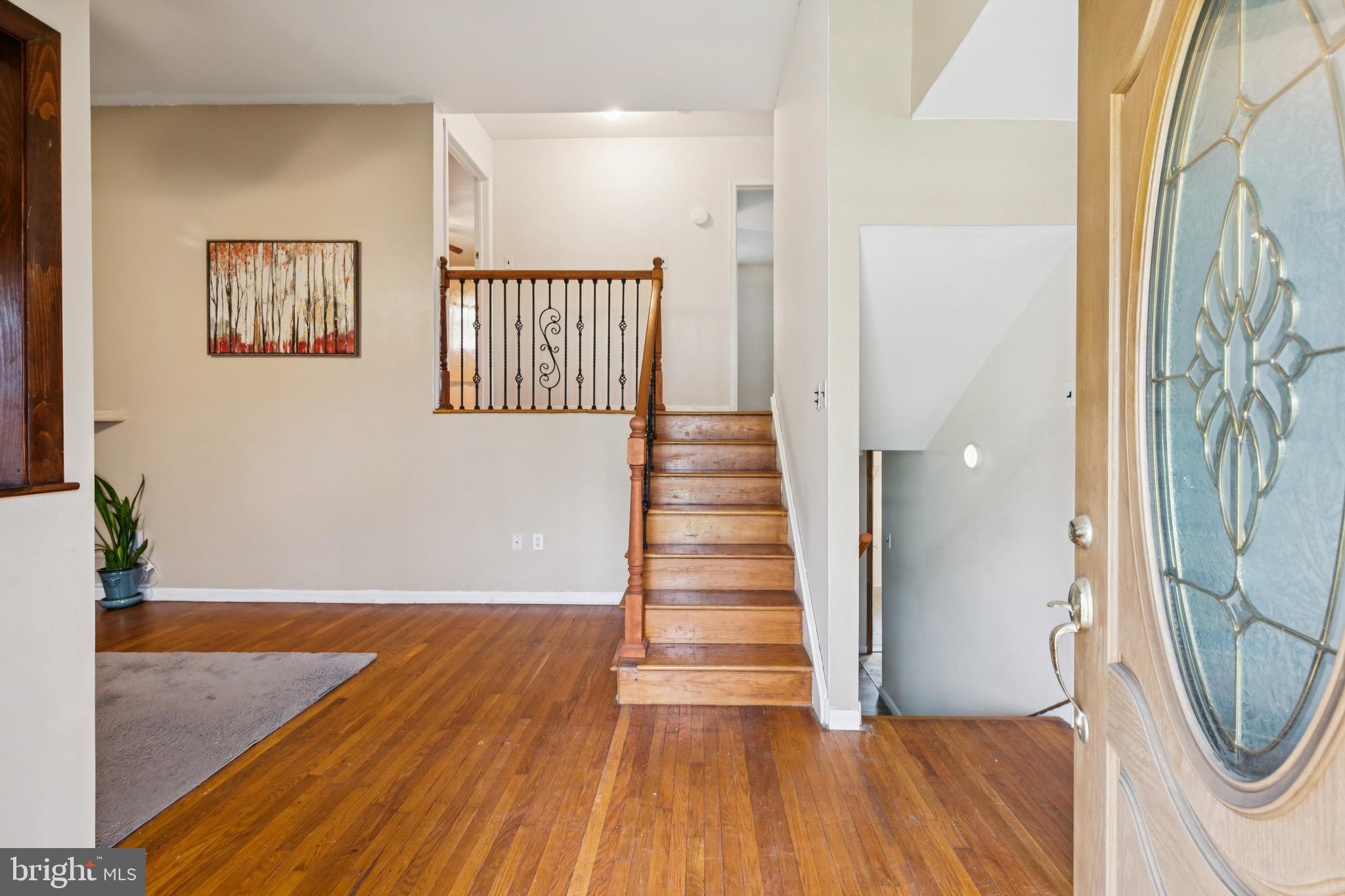 2409 Fries Mill Road Williamstown, NJ 08094 - Photo 3 of 30 a view of a hallway with wooden floor and staircase