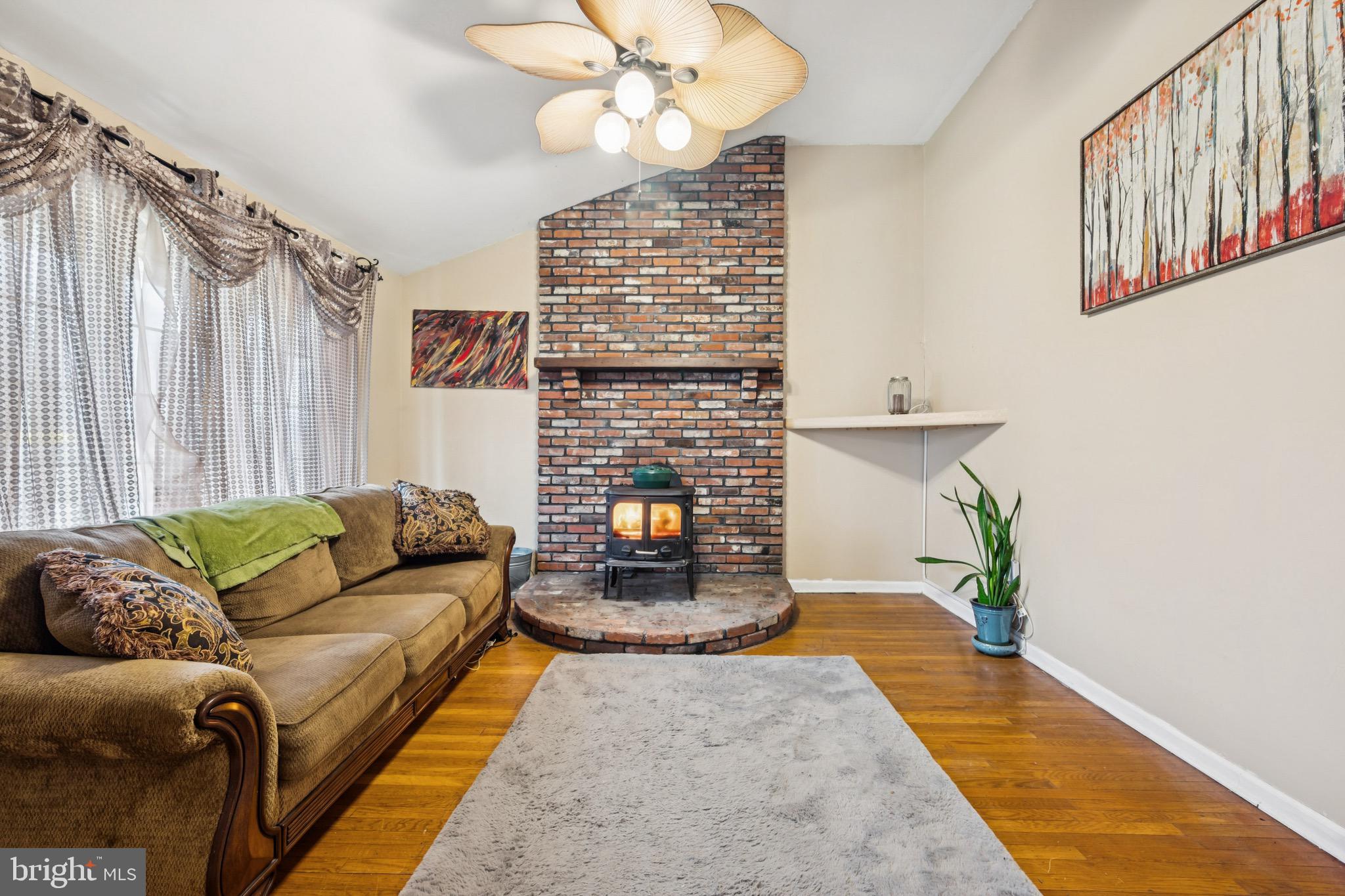 2409 Fries Mill Road Williamstown, NJ 08094 - Photo 5 of 30 a living room with furniture and a fireplace