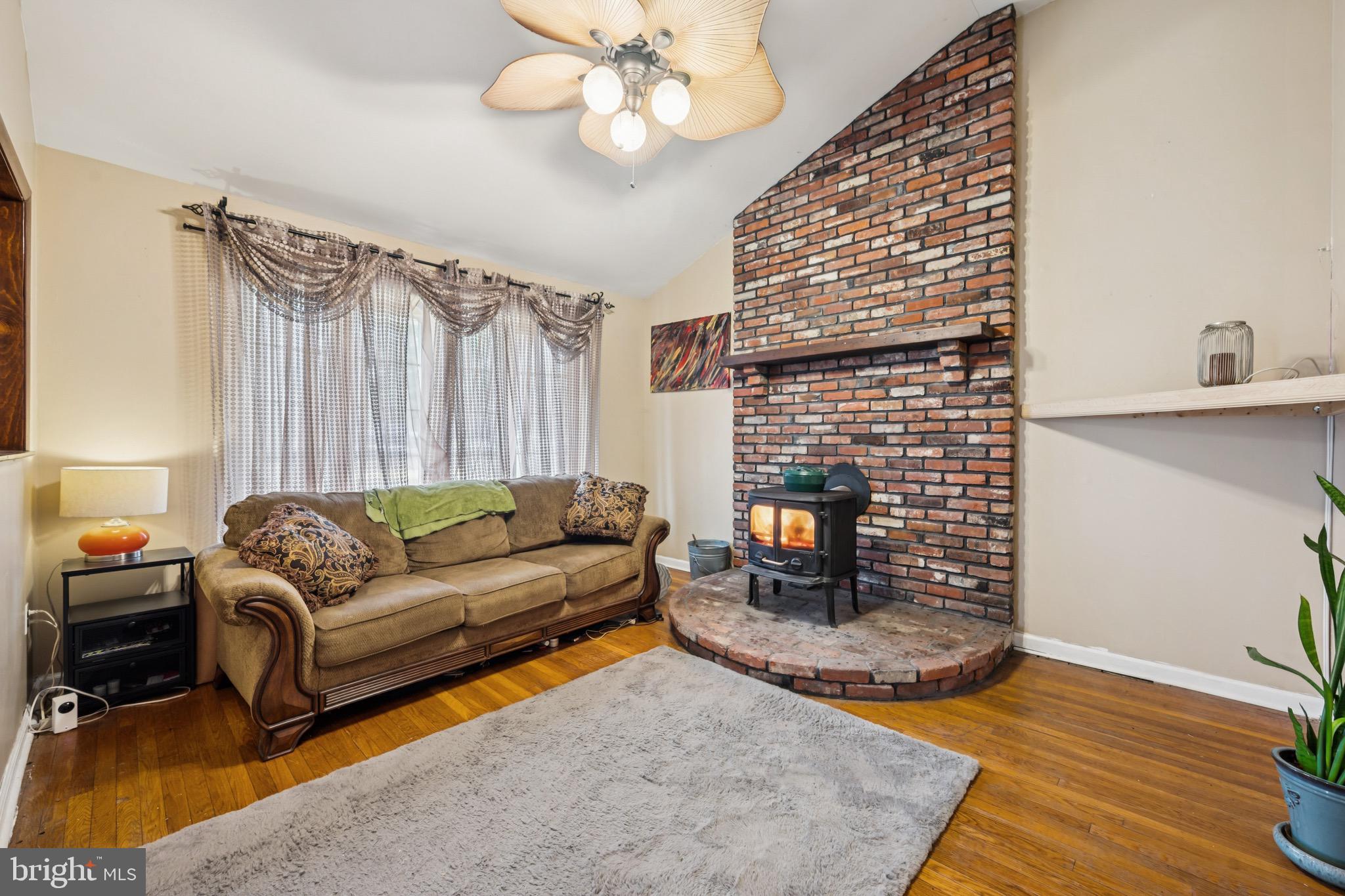 2409 Fries Mill Road Williamstown, NJ 08094 - Photo 6 of 30 a living room with furniture and a fireplace