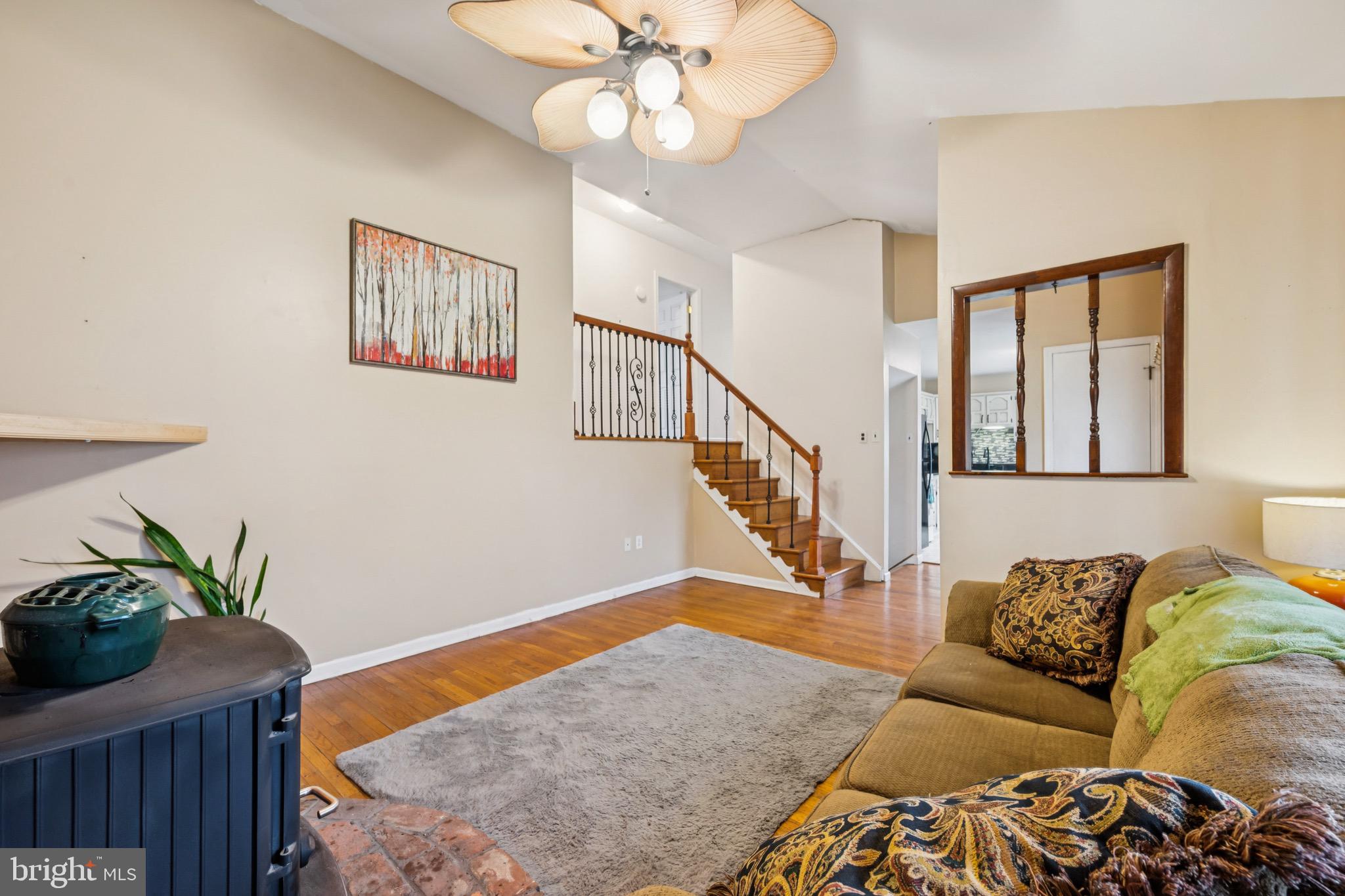 2409 Fries Mill Road Williamstown, NJ 08094 - Photo 8 of 30 a living room with furniture and a potted plant