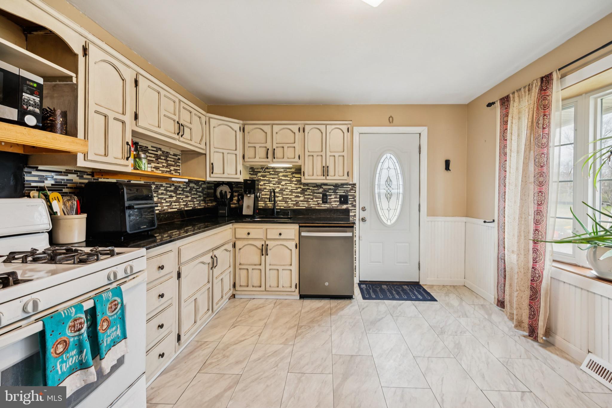 2409 Fries Mill Road Williamstown, NJ 08094 - Photo 10 of 30 a kitchen with stainless steel appliances granite countertop a stove and a refrigerator