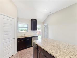3421 Buster Way Corinth, TX 76210 - Photo 5 of 11 a kitchen with granite countertop a sink and a stove