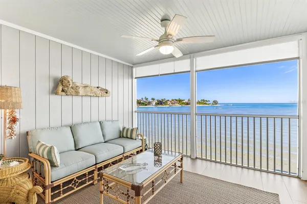 a view of a porch with wooden floor