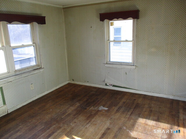 71 Broad Street Meriden, CT 06450 - Photo 12 of 21 an empty room with a window