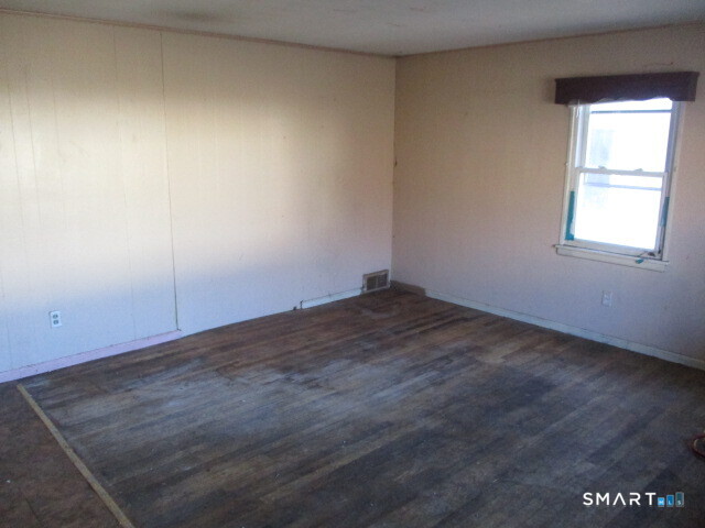 71 Broad Street Meriden, CT 06450 - Photo 5 of 21 an empty room with a window