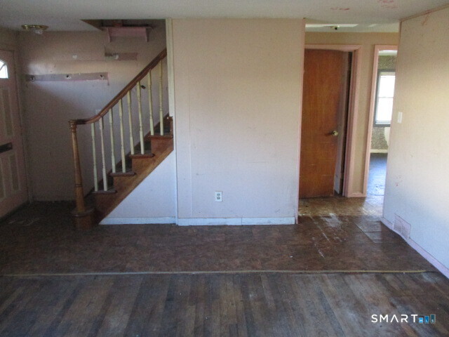 71 Broad Street Meriden, CT 06450 - Photo 6 of 21 a view of a hallway with staircase