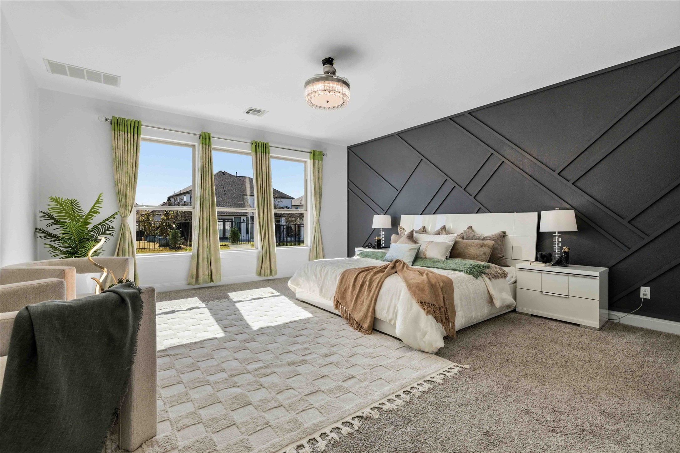 1517 Bardella Drive Leander, TX 78641 - Photo 11 of 40 Carpeted bedroom featuring a decorative wall and an accent wall