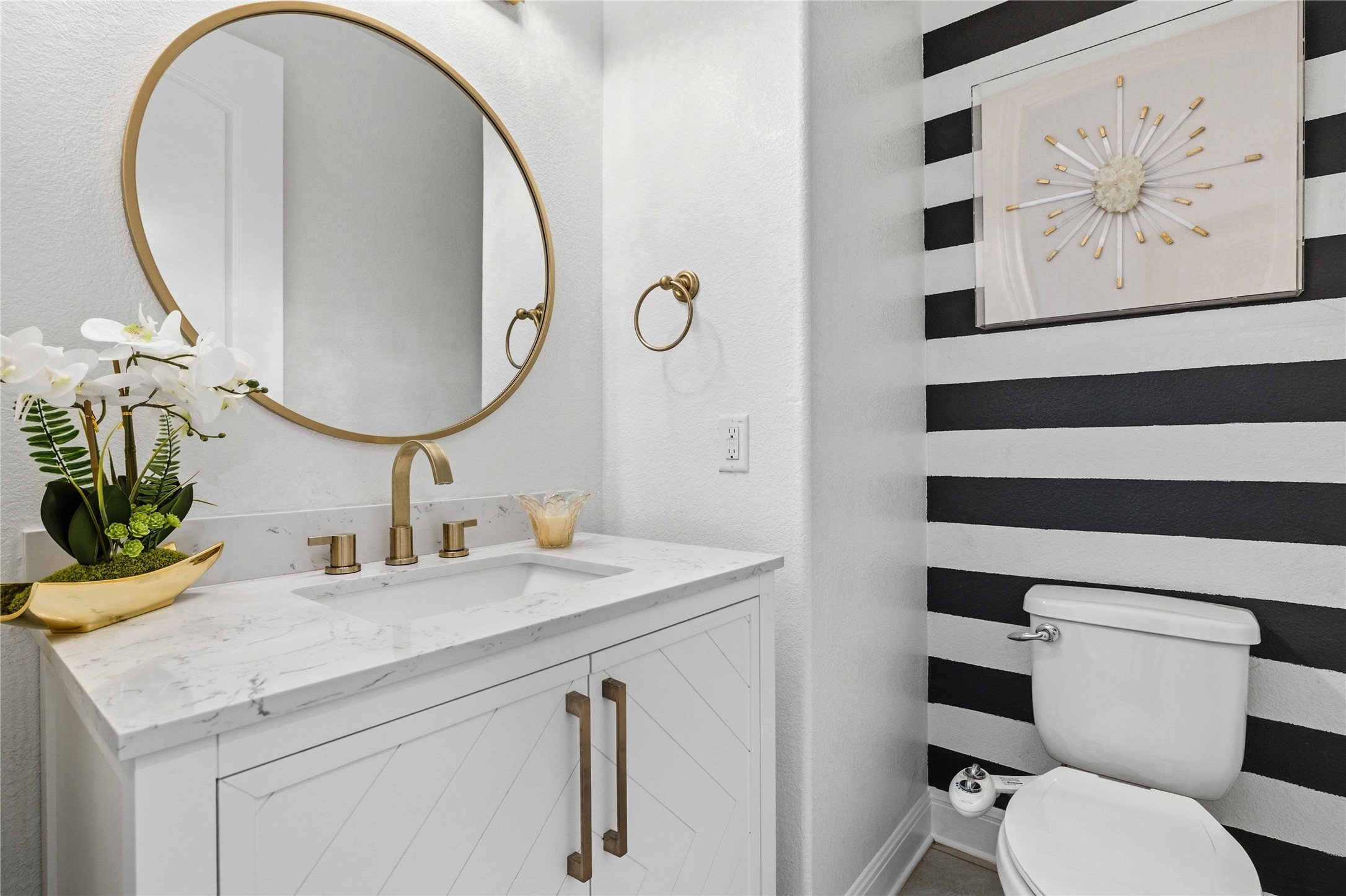 1517 Bardella Drive Leander, TX 78641 - Photo 19 of 40 Half powder bathroom with vanity and a textured wall