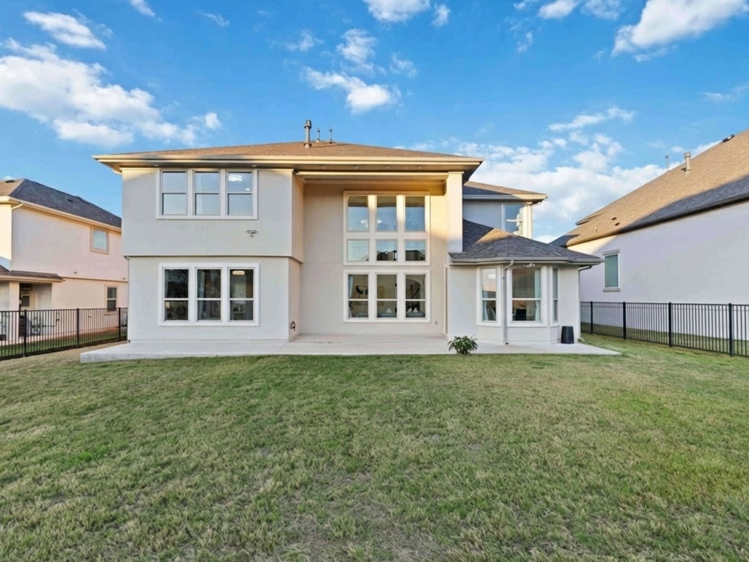 1517 Bardella Drive Leander, TX 78641 - Photo 29 of 40 Back of property with a patio area, stucco siding, and a fenced backyard