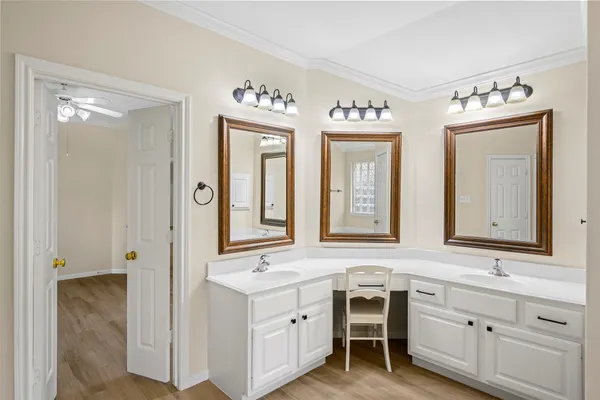 a spacious bathroom with a double vanity sink mirror and