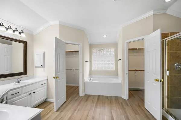 a bathroom with a sink a mirror and a shower