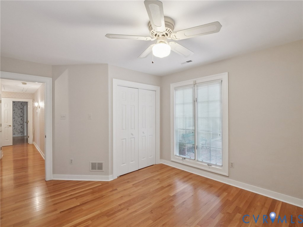 9010 Kings Crown Road North Chesterfield, VA 23236 - Photo 15 of 36 a view of an empty room with wooden floor