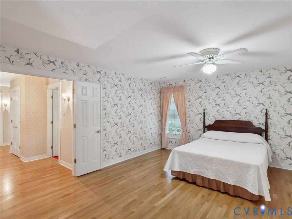 9010 Kings Crown Road North Chesterfield, VA 23236 - Photo 23 of 36 a spacious bedroom with a bed and a window
