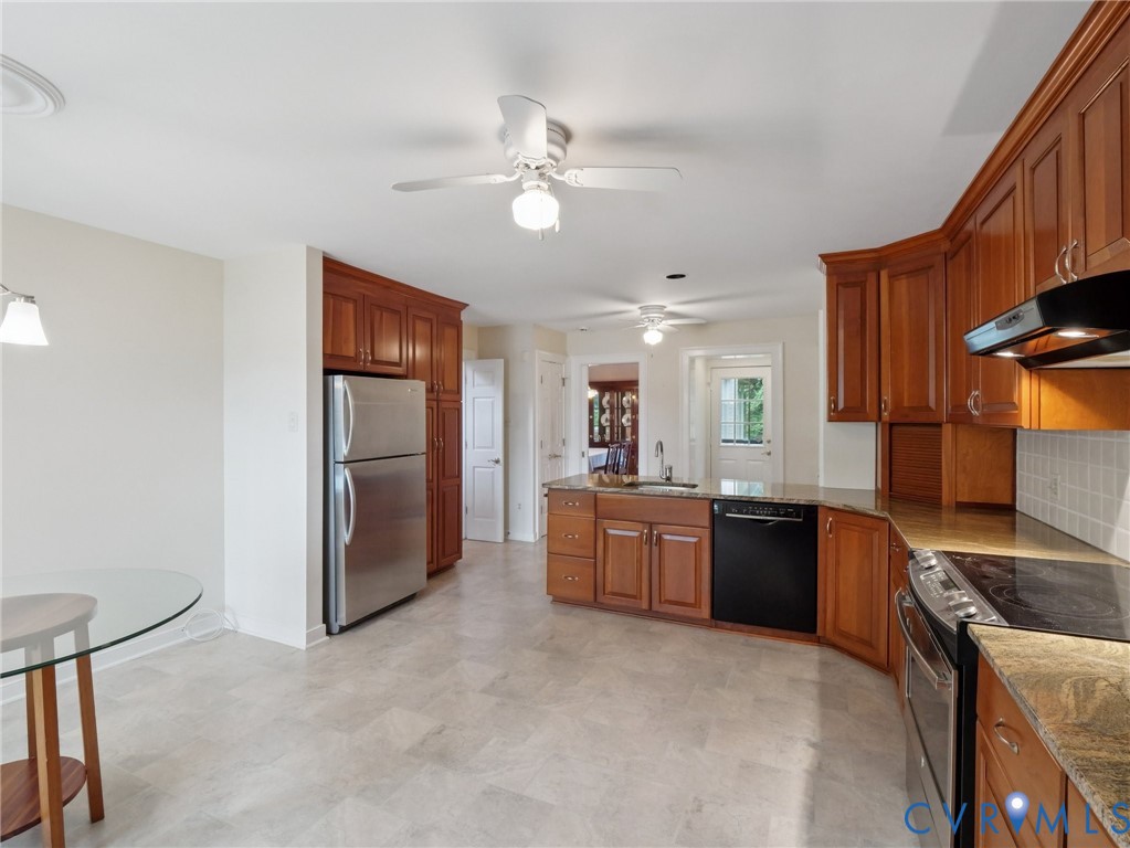 9010 Kings Crown Road North Chesterfield, VA 23236 - Photo 3 of 36 a large kitchen with stainless steel appliances granite countertop a stove refrigerator a sink dishwasher with a dining table and chairs