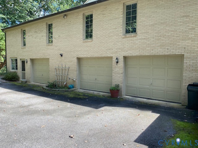 9010 Kings Crown Road North Chesterfield, VA 23236 - Photo 31 of 36 a front view of a house with a yard and garage