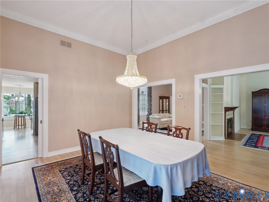 9010 Kings Crown Road North Chesterfield, VA 23236 - Photo 7 of 36 a dining room with a table chairs and a table
