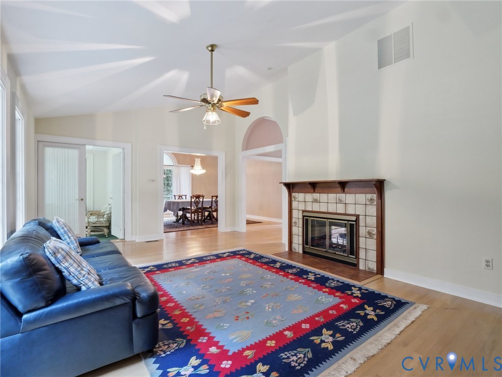 9010 Kings Crown Road North Chesterfield, VA 23236 - Photo 10 of 36 a living room with furniture and a fireplace