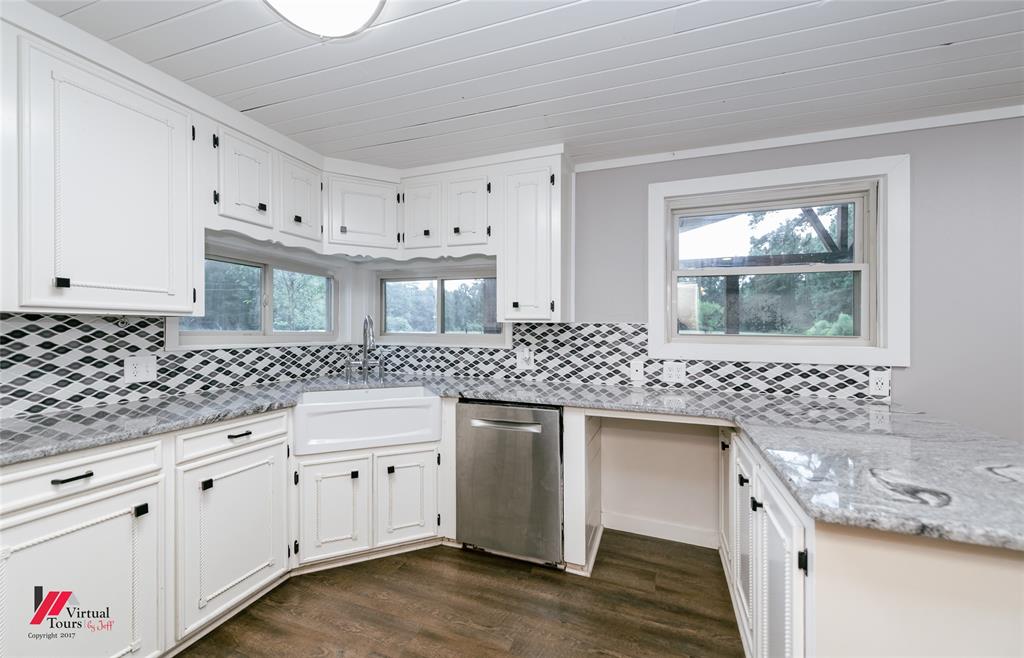 1177 Princeton Road Princeton, LA 71067 - Photo 11 of 34 a kitchen with a sink stove and cabinets