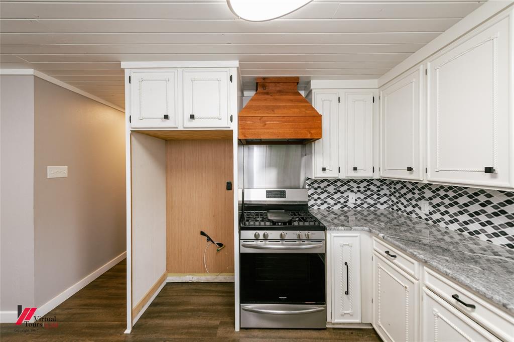 1177 Princeton Road Princeton, LA 71067 - Photo 12 of 34 a kitchen with stainless steel appliances granite countertop a stove and a refrigerator