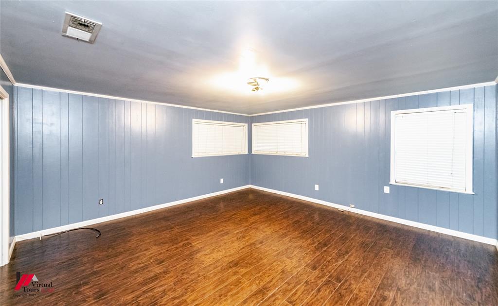 1177 Princeton Road Princeton, LA 71067 - Photo 13 of 34 a view of an empty room with window and wooden floor