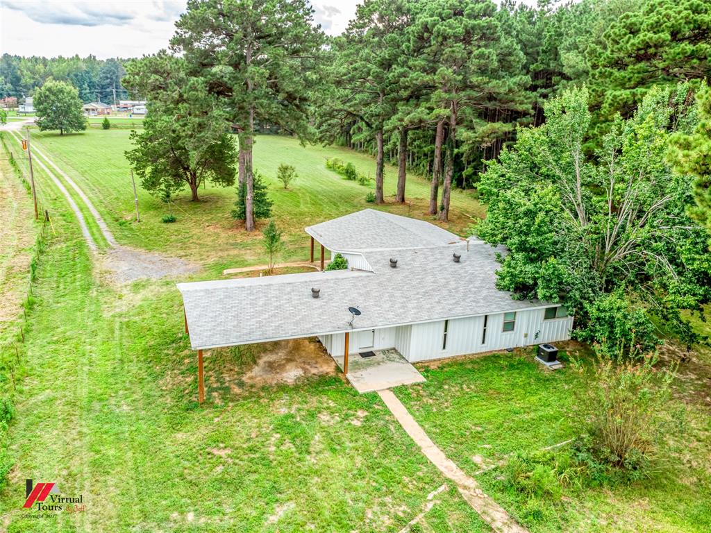 1177 Princeton Road Princeton, LA 71067 - Photo 24 of 34 a view of a house with a yard