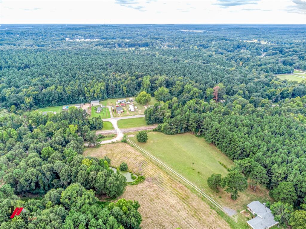1177 Princeton Road Princeton, LA 71067 - Photo 33 of 34 a view of a swimming pool with a yard