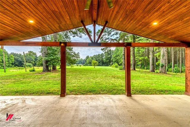 a view of a patio with a backyard