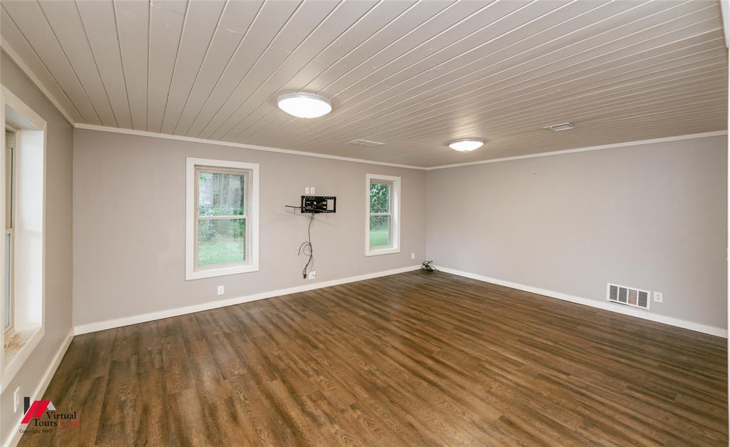1177 Princeton Road Princeton, LA 71067 - Photo 8 of 34 wooden floor in an empty room with a window