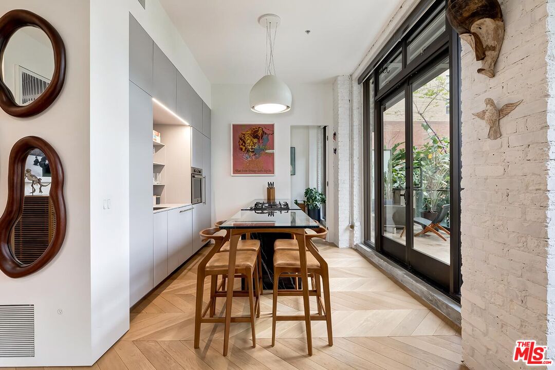460 South Spring Street, Unit 201 Los Angeles, CA 90013 - Photo 4 of 27 a view of a hallway with furniture and entryway