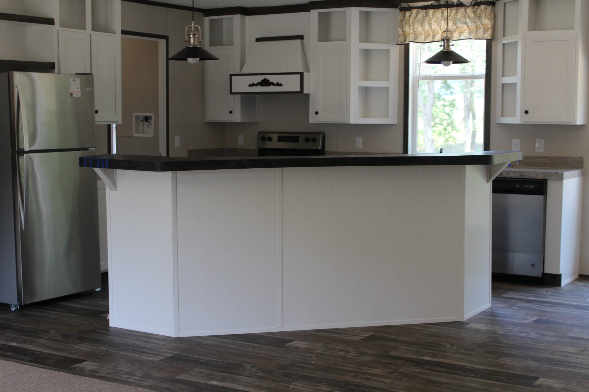 599 Days Road Lafayette, TN 37083 - Photo 8 of 16 a view of a refrigerator in kitchen and wooden floor