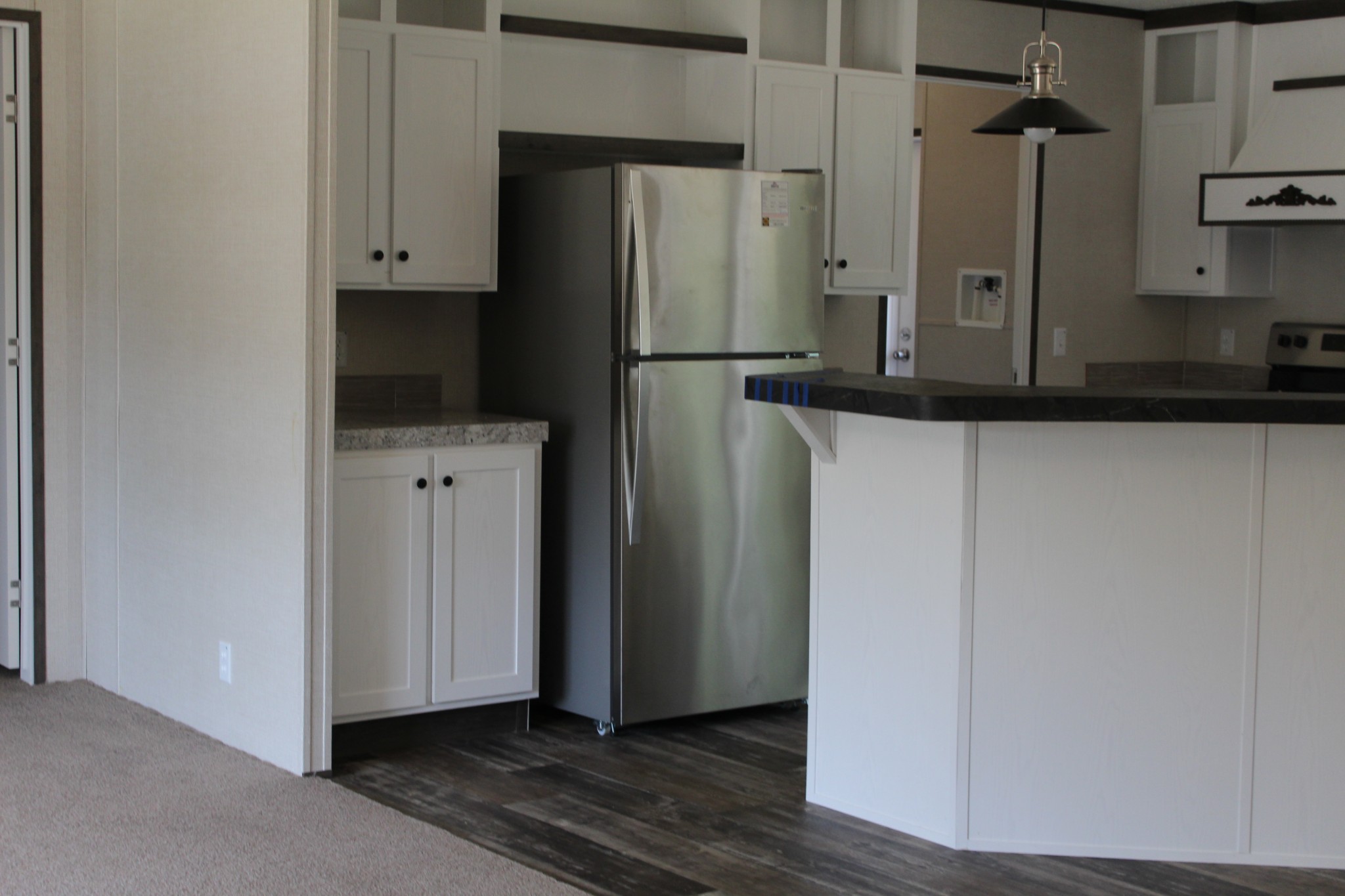 599 Days Road Lafayette, TN 37083 - Photo 9 of 16 a view of a refrigerator in kitchen and white cabinets