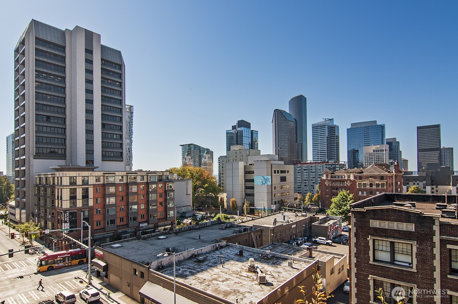 1105 Spring Street, Unit 709 Seattle, WA 98104 - Photo 14 of 30 a couple of cars parked in front of buildings